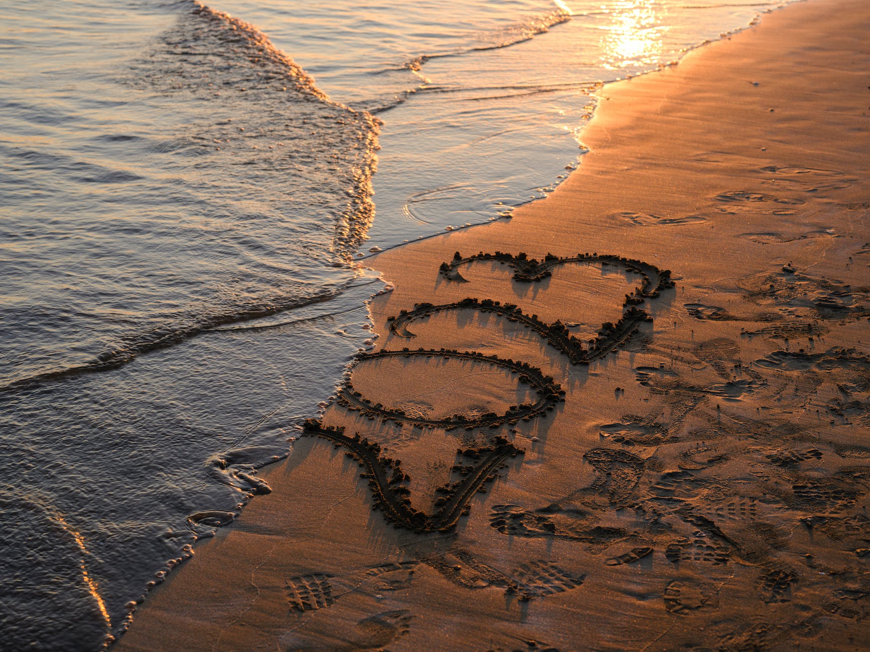 2023 written on beach shore